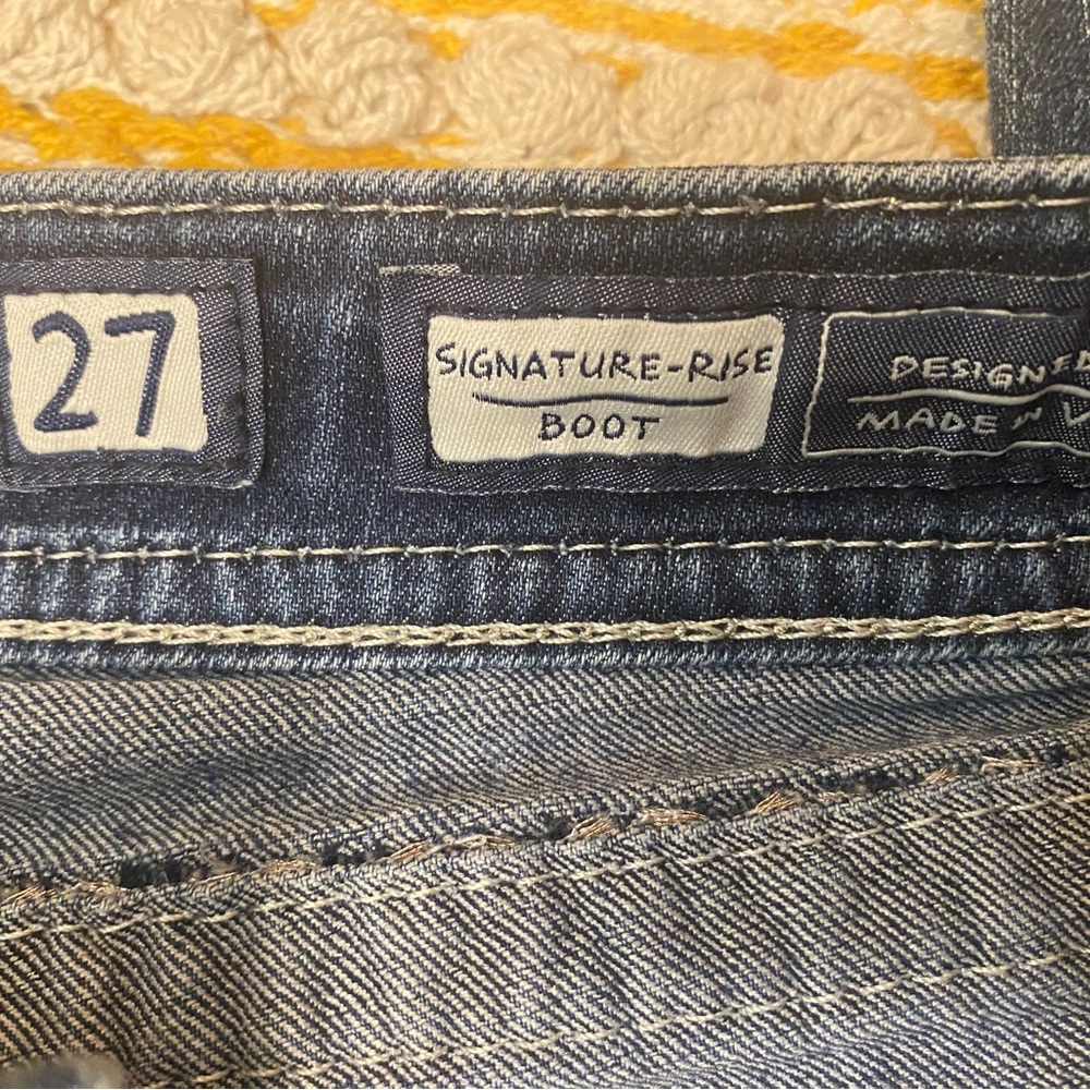 Light wear on the cuffs, otherwise like new.